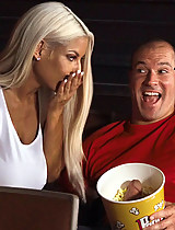 Bridgette B fingers her dripping wet pussy in the cinema